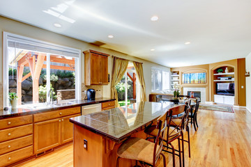 Wood classic large kitchen with granite island.