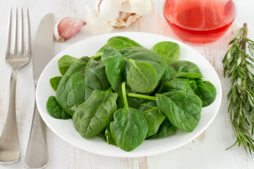 fresh spinach on the white plate