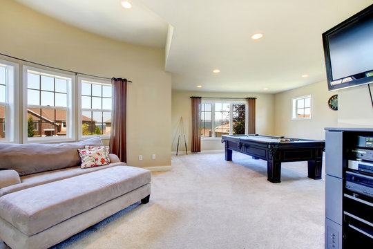 Large Family Room With Pool Table And Tv.