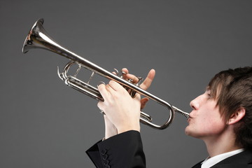 Portrait of a young man playing his Trumpet