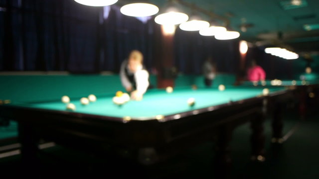 Playing russian billiard in a poolroom