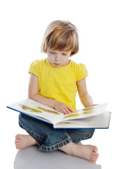 little girl reading a book. isolated