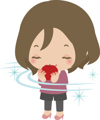 リンゴの香りを嗅ぐ若い女性