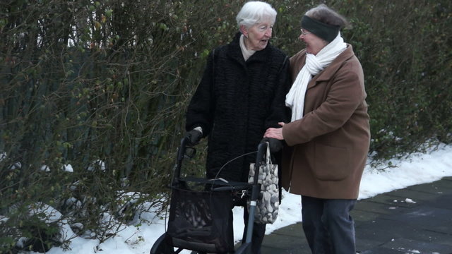 Senior walking with assistance