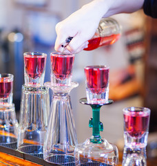 barman making cocktail drinks