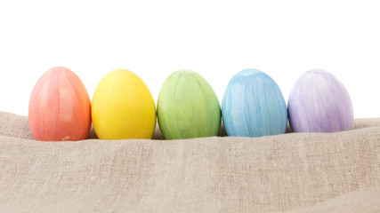 easter eggs on burlap in a row