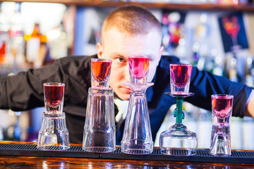 barman making cocktail drinks