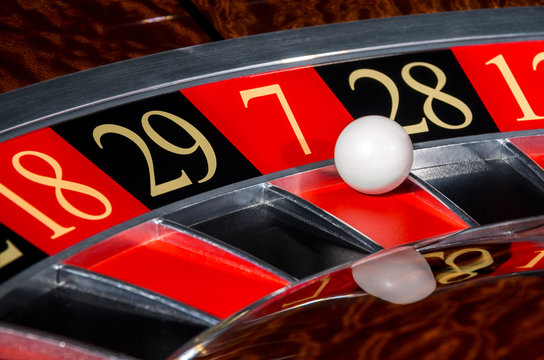Classic casino roulette wheel with red sector seven 7