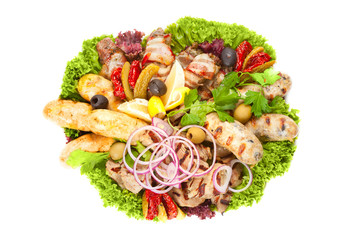 Grilled meat, sausages and vegetables on white background