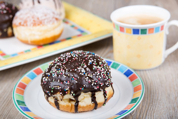 Chocolate and coconut donuts with carnival decoration.