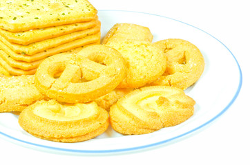 Milk butter cookies on white dish is isolated