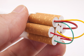 Hand holding stack of Cigarettes