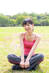 Fototapeta na wymiar attractive asian woman relaxing in the park