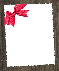 blank paper sheet with red bow