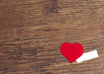 Red heart on wood