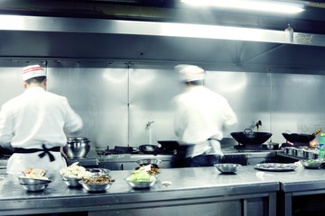 motion chefs of a restaurant kitchen