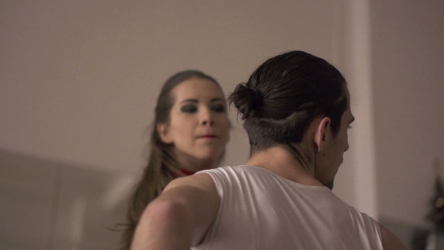 Woman slapping man in the face, super slow motion