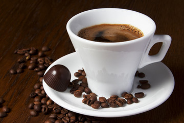 A cup of coffee flavored with chocolate close-up