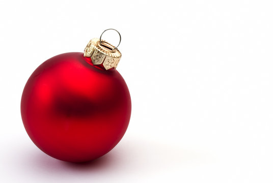 Red christmas bauble on a white background