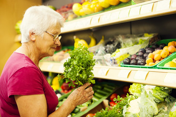 Senior woman at supermarket.