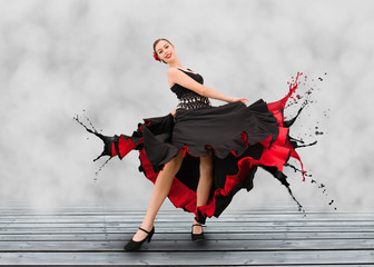 Flamenco dancer with dress turning to paint splashes