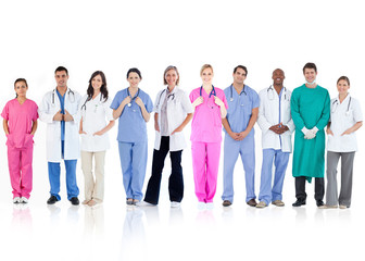 Happy team of doctors standing together in a line