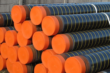 piles of plastic pipes and conduits for transporting gas
