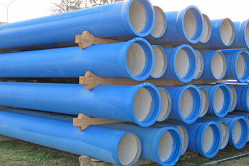 piles of concrete pipes for transporting  sewerage