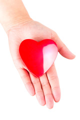 Heart in hand as love and health symbol