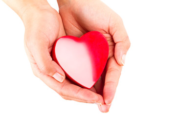 Heart shape in hands as love symbol