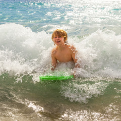 boy has fun at the beach