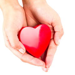Heart shape in hands as love symbol