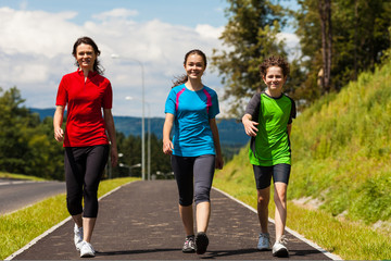 Fototapeta premium Active family - mother and kids running outdoor