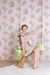 Fototapeta premium woman sitting on the swing