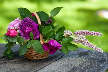 basket of roses on garden table