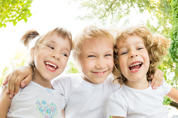 Fototapeta premium Low angle view portrait of happy children