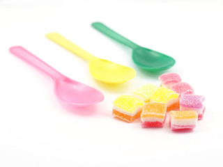 Colorful sweet jelly and spoons