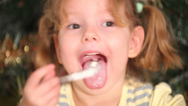 The girl is eating a cake