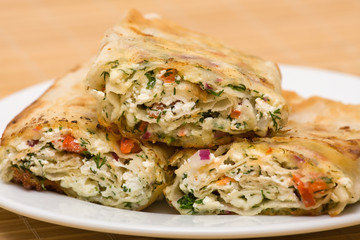 Pita bread wrapped with cottage cheese and vegetables