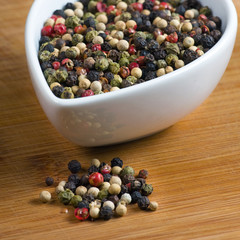 peppercorns on a wooden board