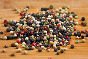 peppercorns on a wooden board