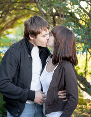 romantic young couple kissing...