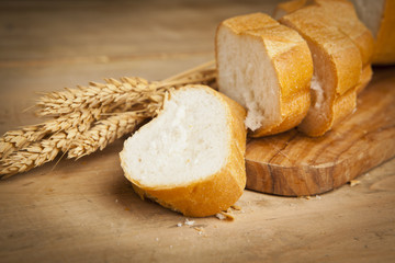 assortment of fresh baked bread on wood table