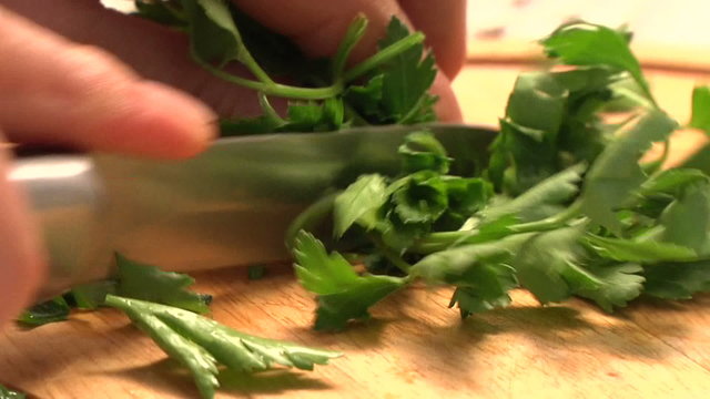cutting parsley in the kitchen