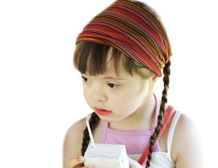 Portrait of little girl with white juice box