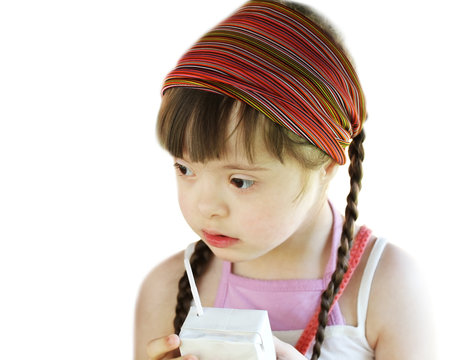 Portrait Of Little Girl With White Juice Box