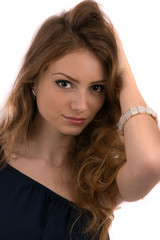 Fototapeta premium beautiful young woman with hands in hair isolated on white backg