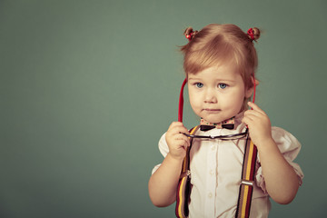 Beautiful smiling girl on a green background.
