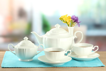 Beautiful tea service on wooden table