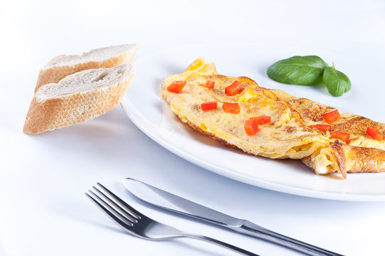 Egg omelette with pieces of red pepper